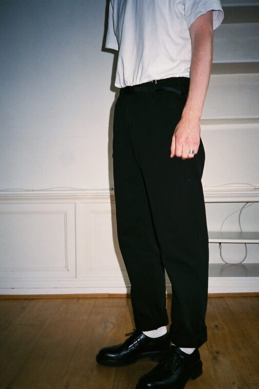 Side view of the Gramicci Pants in black. Our pick for the best comfortable pants for men.
