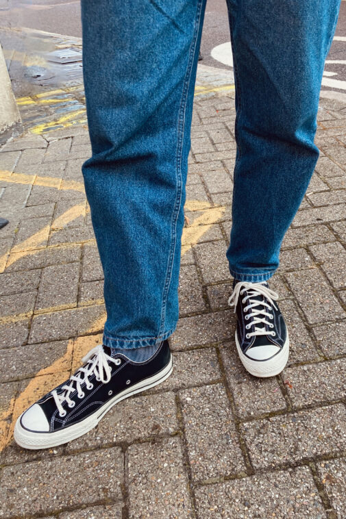 The APC Martin jeans in a mid-blue worn with black converse all-stars.