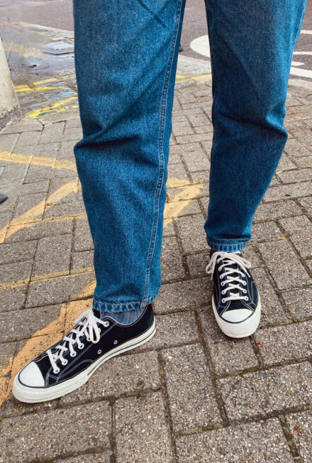 The APC Martin jeans in a mid-blue worn with black converse all-stars.